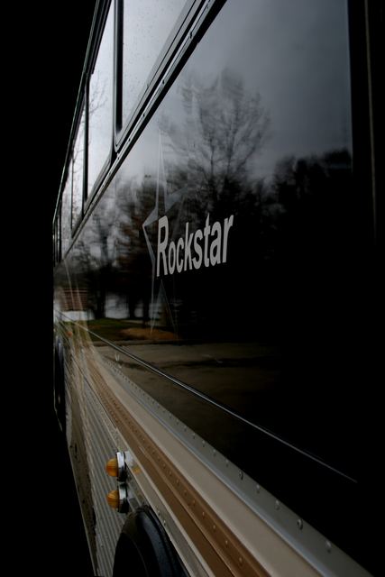 Reflection of the Rockstar logo in the coach's side